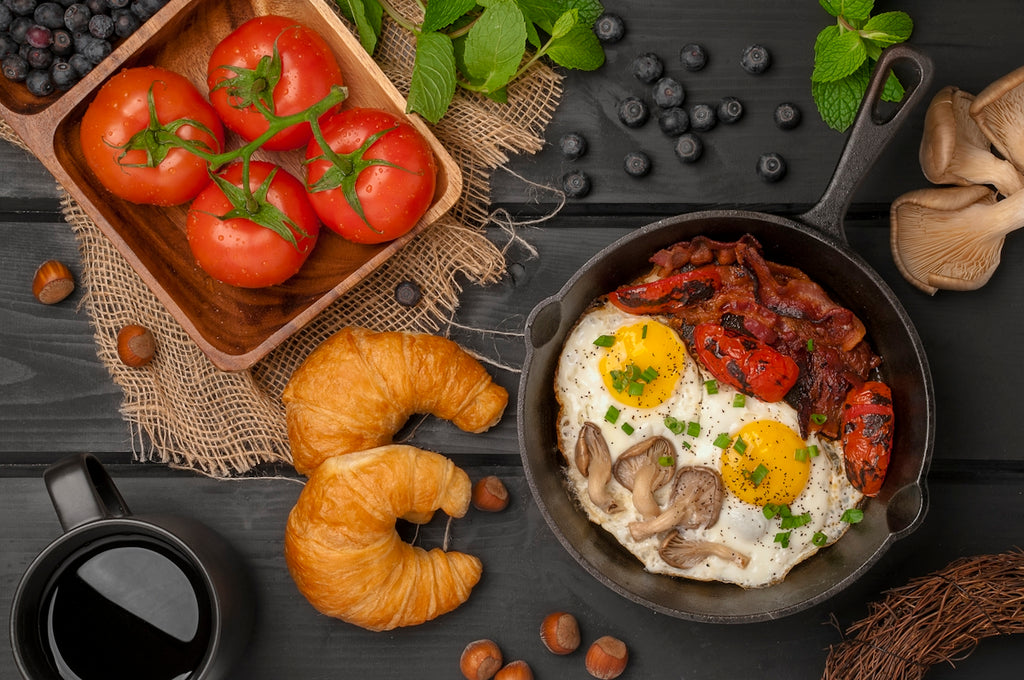A table topped with a bowl of food and a cup of coffee